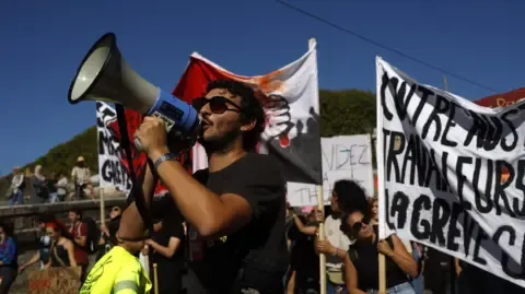 Countrywide Walkouts Break Out Opposing Spending Slashing